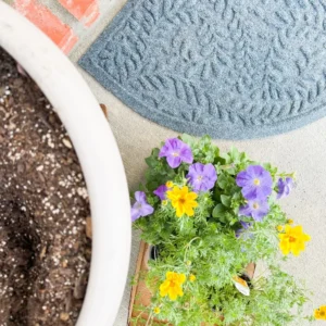 How to Execute a Simple and Durable Spring Porch Upgrade with Seasonal Decor and Functional Matting